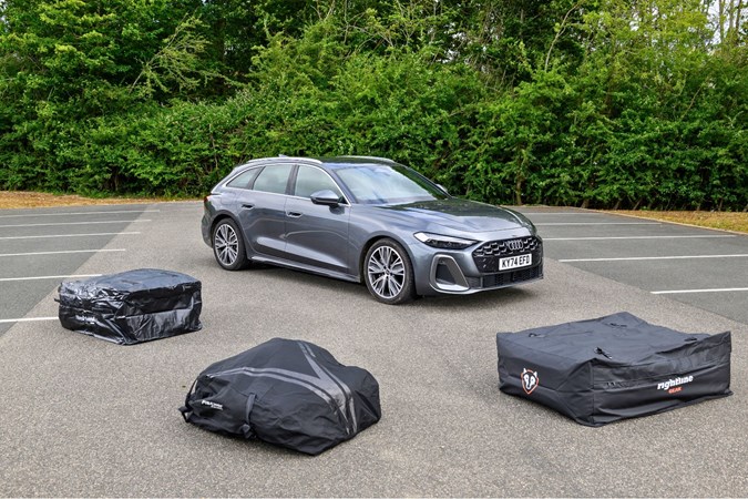 Three roof bags grouped together next to Audi A5 Avant