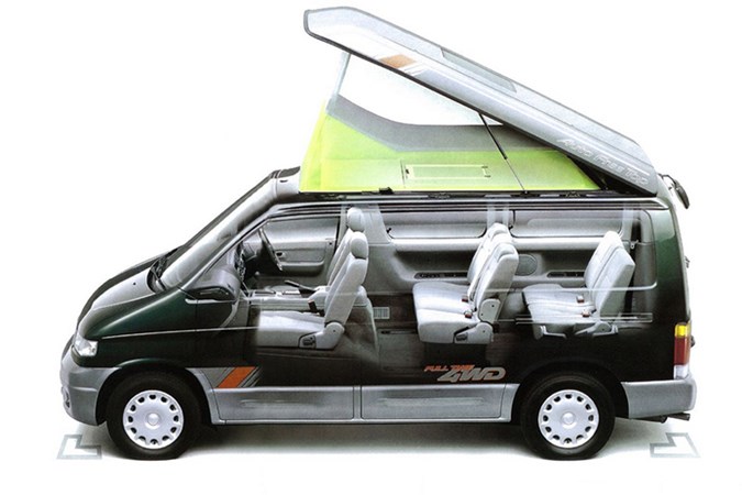 Side profile image of a black Mazda Bongo with the interior seating on show and roof popped