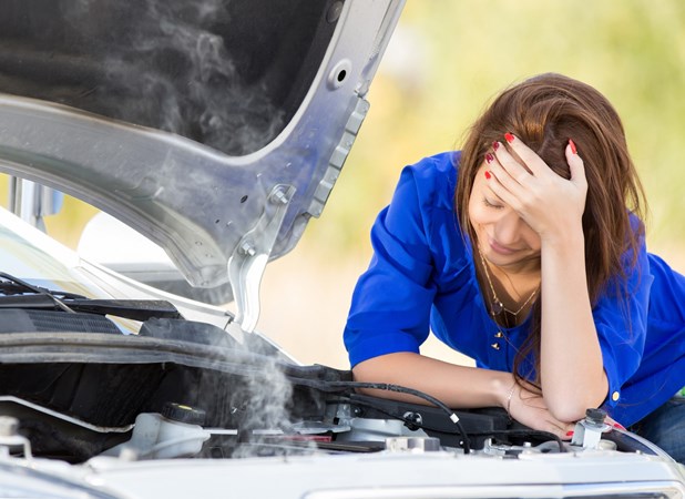 Woman with broken down car - How to change engine oil