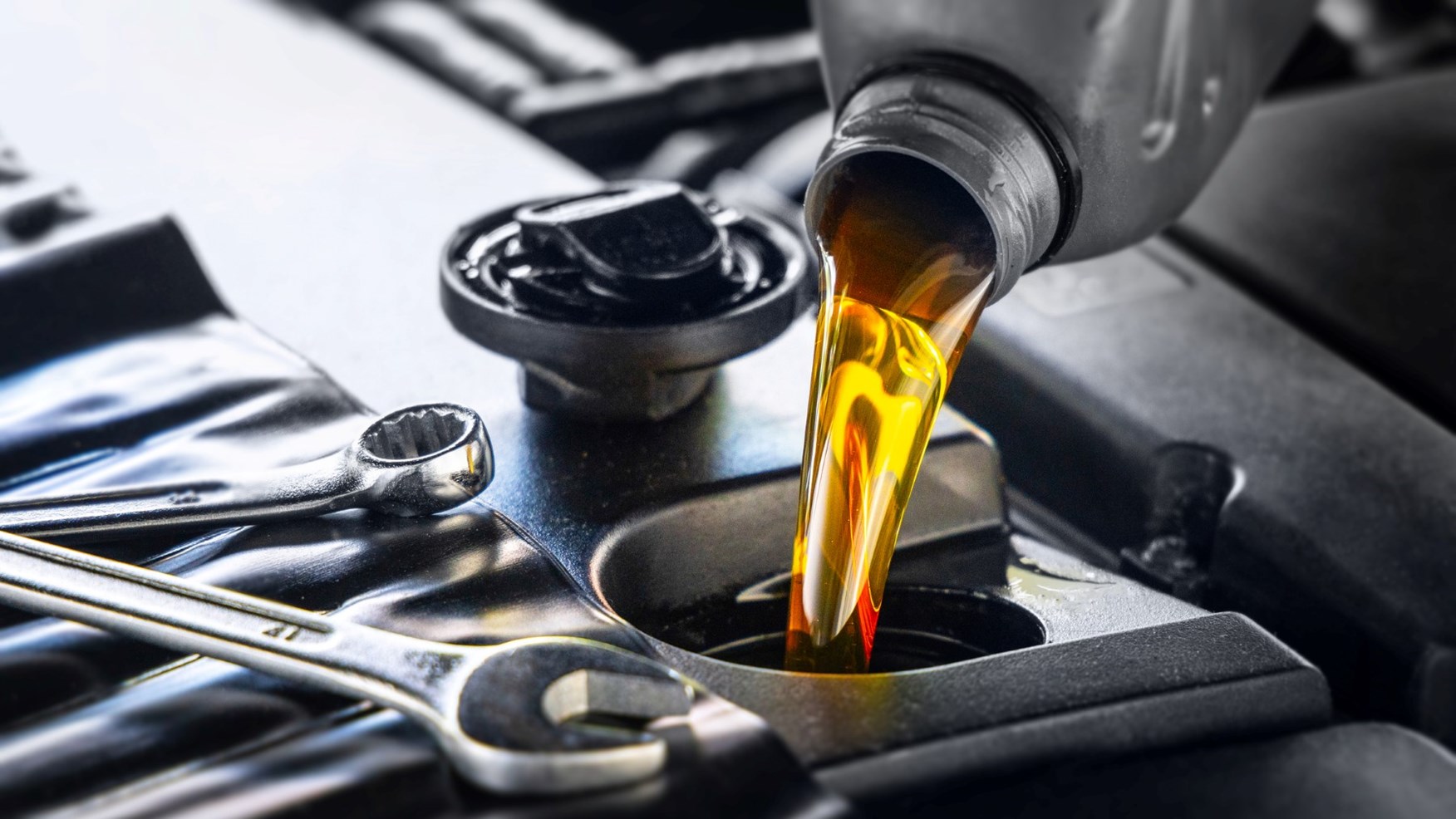 gettyimages adding engine oil - What To Minimally Check When Inspecting Your Car’s Engine