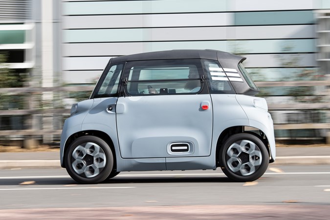 Citroen Ami (2022) review: side view driving shot, grey car, stripes on rear quarter panel