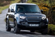 Land Rover Defender 130 (2025) front three-quarter driving