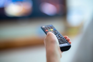 A TV remote pointed at a TV