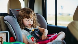 A child sat in a car seat