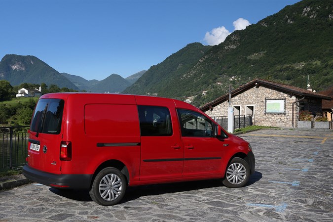 VW Caddy TGI review - rear view, parked by mountain