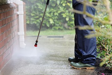 Pressure washing a driveway