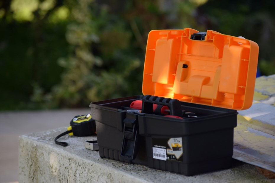 A plastic, orange toolbox