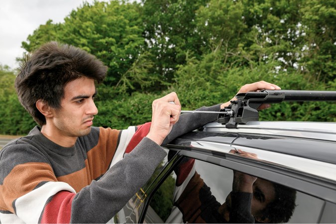 Aaron Hussain bolting a roof bar