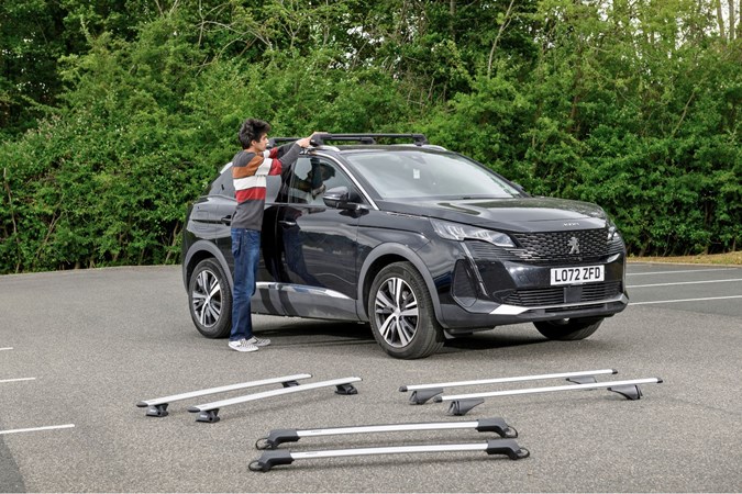 Aaron Hussain next to a set of roof bars