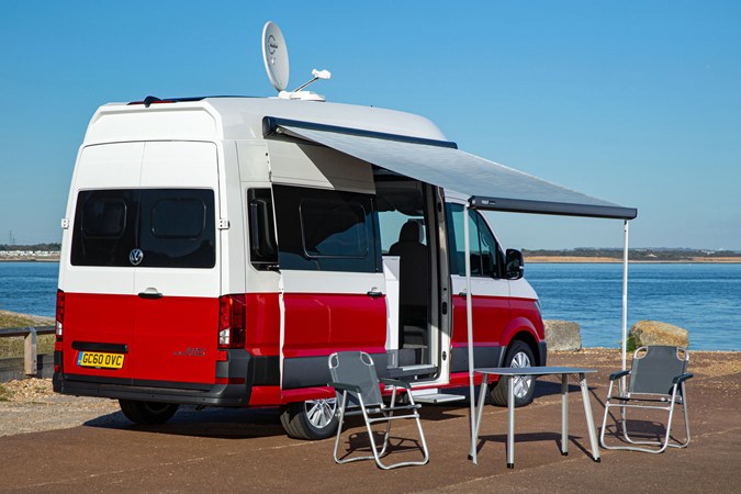 VW Grand California camper review - 2019 UK 600 model, all set-up for camping, rear view, red and white