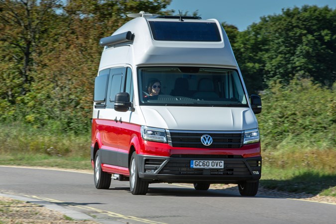 VW Grand California camper review - 2019 UK 600 model, front view, driving, red and white