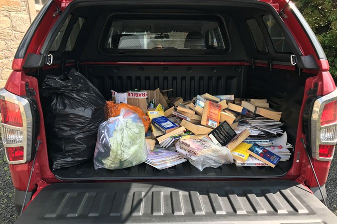 Clearing house with a SsangYong Musso - loading the back with magazines and books