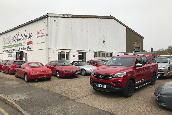 Autolusso Alfa Romeo specialists with SsangYong Musso pickup towing car
