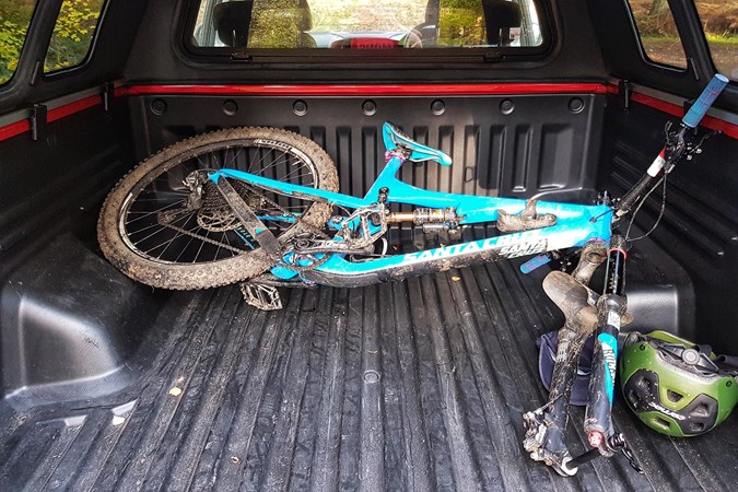 Washing a bike in the back of the Musso? It's possible!