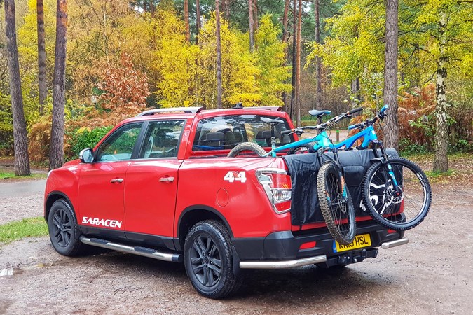 Two bikes loaded into a Ssangyong Musso pickuo