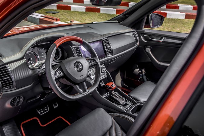 Skoda Mountiaq pickup truck review - cab interior, dashboard, steering wheel, finished in black and orange
