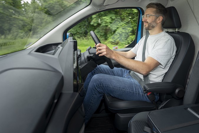 Parkers Van and Pickup Editor Tom Webster driving a van