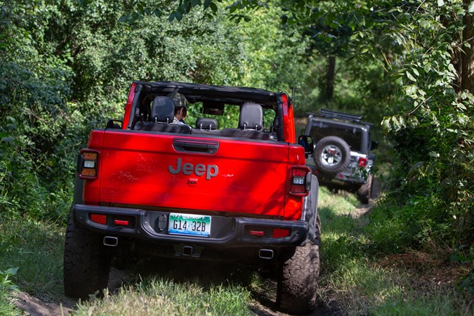2019 Jeep Gladiator review - rear view, red, driving off-road