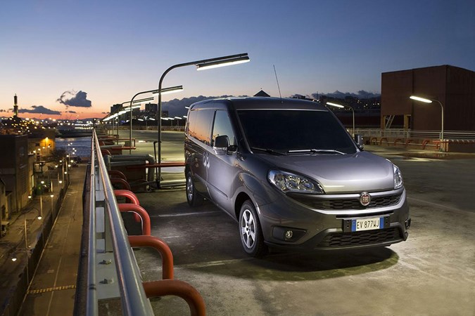 Fiat Doblo MY20, 2019, grey, front view, parked on top of multi-storey car park at night