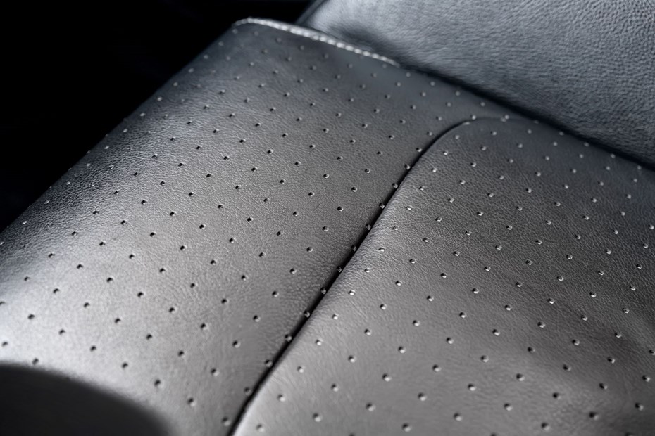 Closeup of a leather car seat base