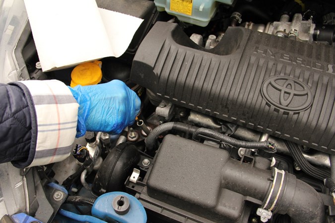 Checking the oil on a car