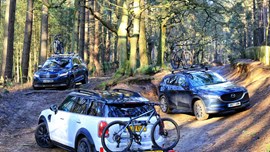 Three cars with different bike racks