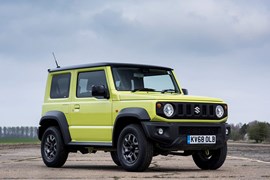 Yellow 2019 Suzuki Jimny front three-quarter