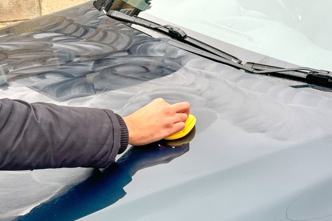 Meguiar's Gold Glass Carnauba Plus Premium Wax being applied to a car