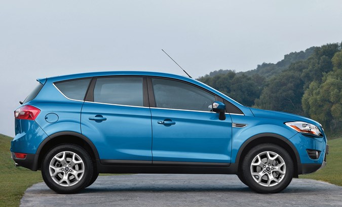 Best used family 4x4s: Ford Kuga, side view static, blue paint