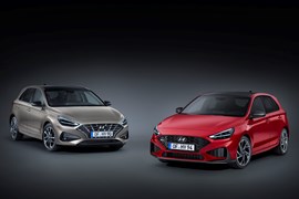 Beige and red 2020 Hyundai i30 Hatchbacks front three-quarter