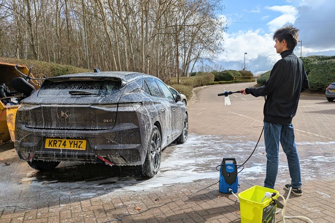 Aaron Hussain spraying snow foam onto a DS4