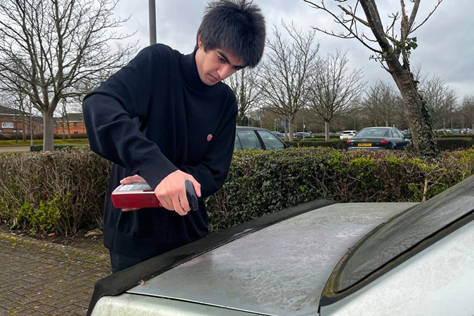 Aaron Hussain applies Car Gods pre-wash to a car