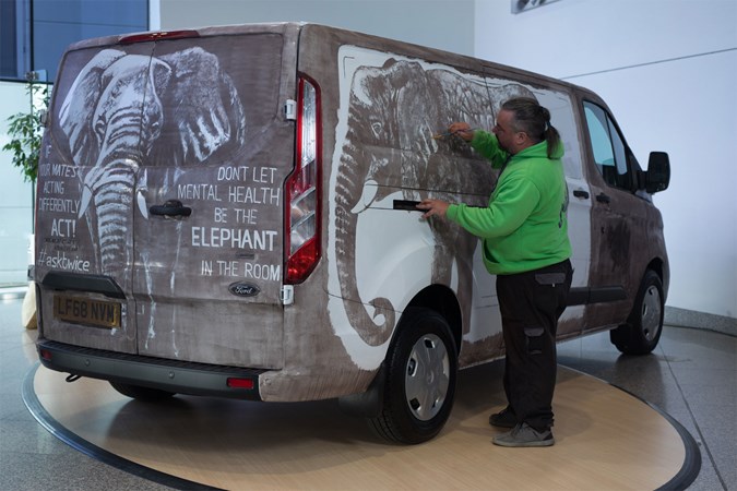 Ford Transits mental health awareness van with elephants drawn in dirt