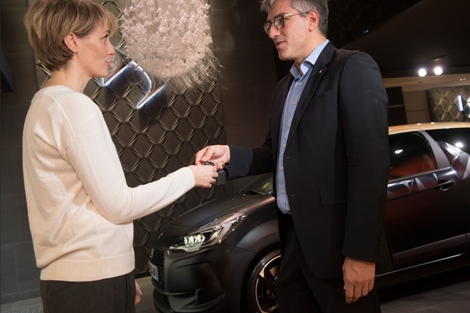 Getting a fair deal for your car - man and woman exchanging keys - free Parkers car valuations