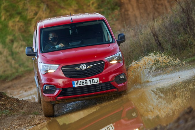 Vauxhall Combo Cargo 4x4 review - red, front view, splashing through mud