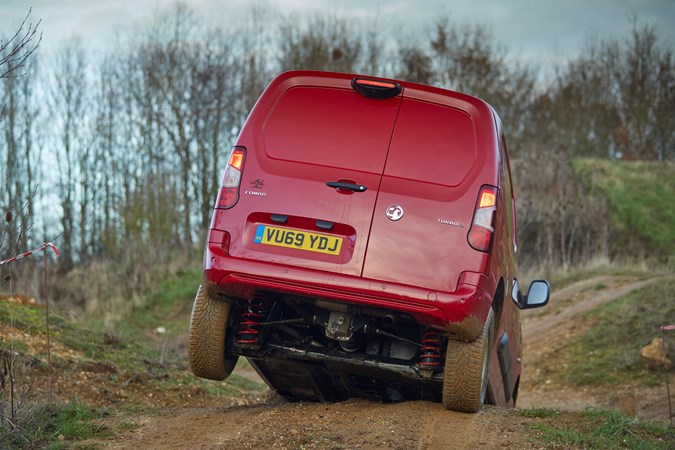 Vauxhall Combo Cargo 4x4 review - red, rear view, wheel off ground, showing suspension and rear differential