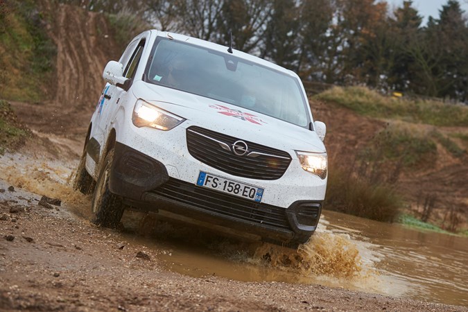 Vauxhall Combo Cargo 4x4 review - white, front view, driving through mud
