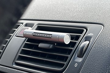 The FUMEBAR in a car's air vent