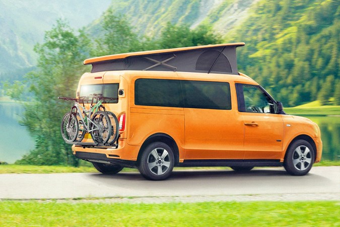 LEVC e-Camper electric campervan, on sale in 2021 - orange, rear view, with pop-top, mountain bikes