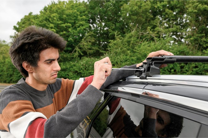 Aaron Hussain installing roof bars