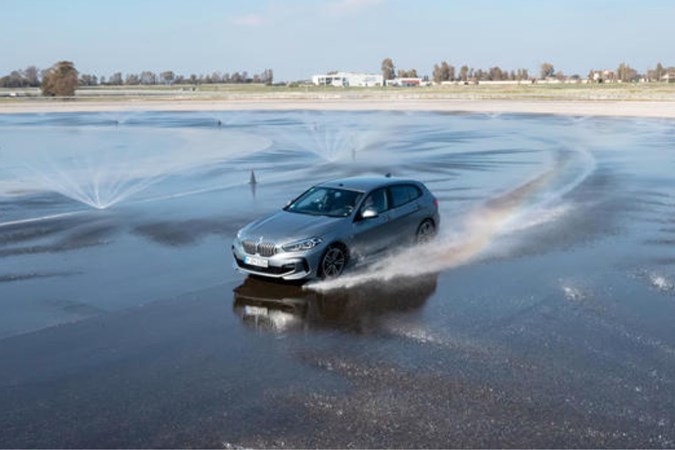 BMW 1-Series on wet circle track