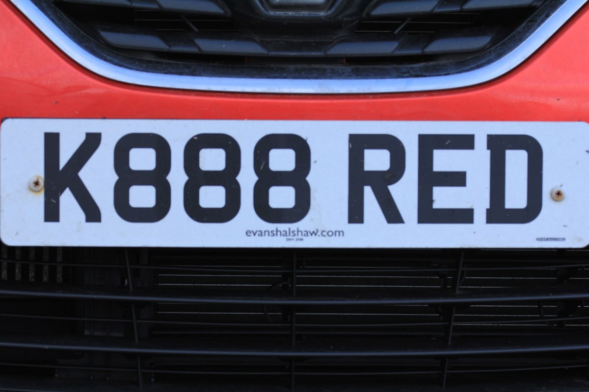 Red store number plate