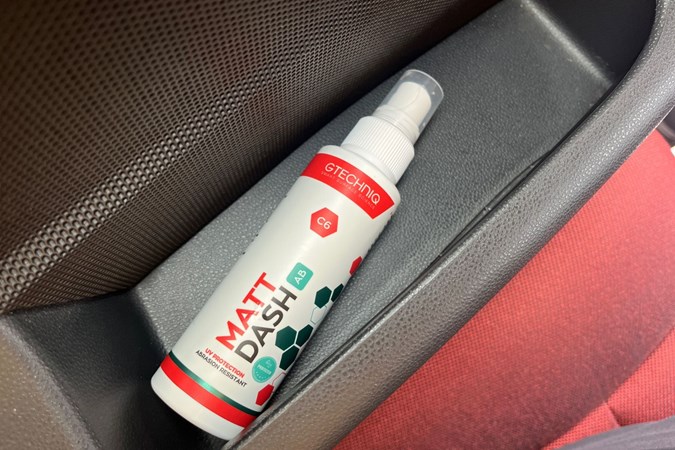 The bottle of Gtechniq C6 in a car