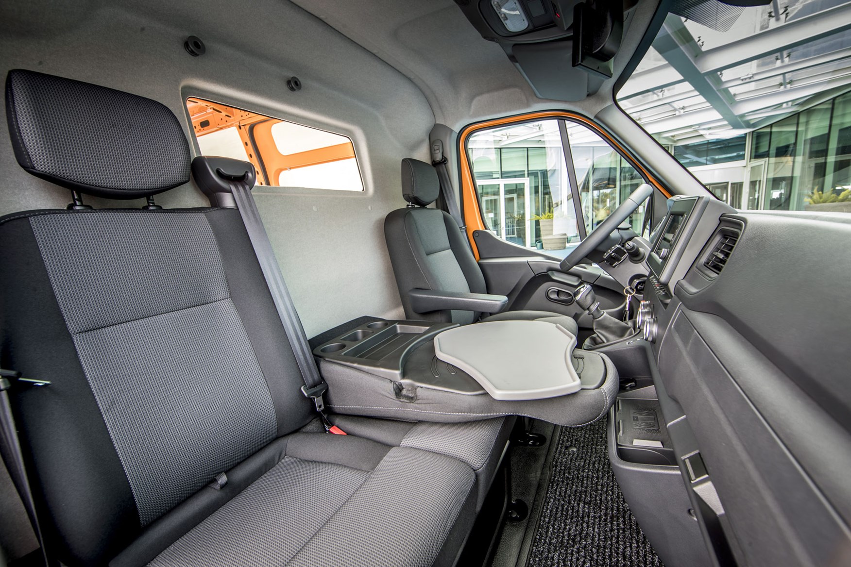 Renault Master review - 2019 facelift cab interior showing mobile office with swiveling laptop tray
