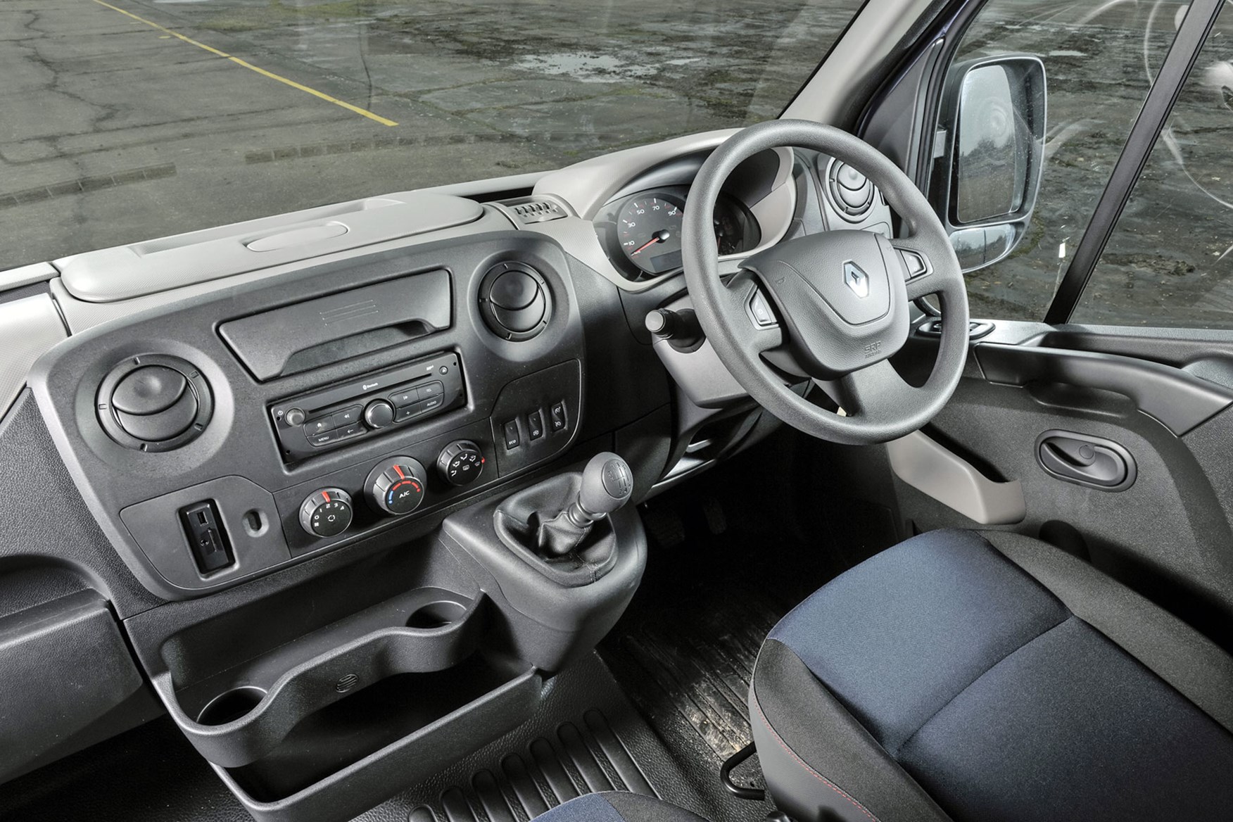 Renault Master review - 2016 model cab interior showing dashboard, steering wheel and storage
