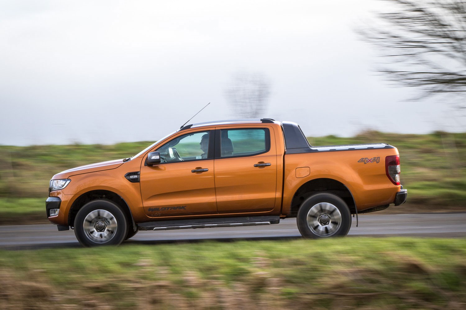 Ford Ranger review - 2016 facelift, side view, driving, Wildtrak, orange