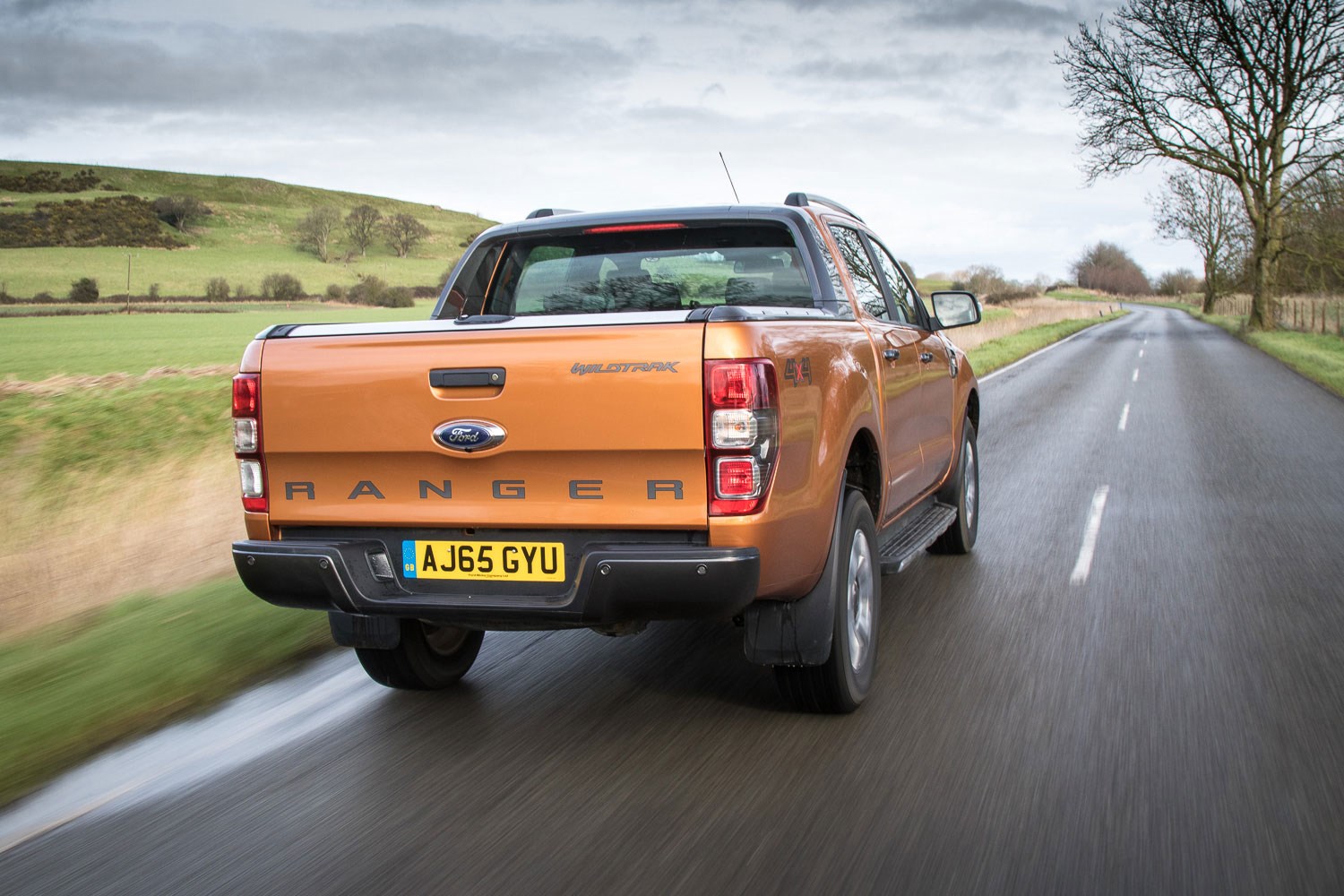 Ford Ranger review - 2016 facelift, rear view, driving, orange Wildtrak