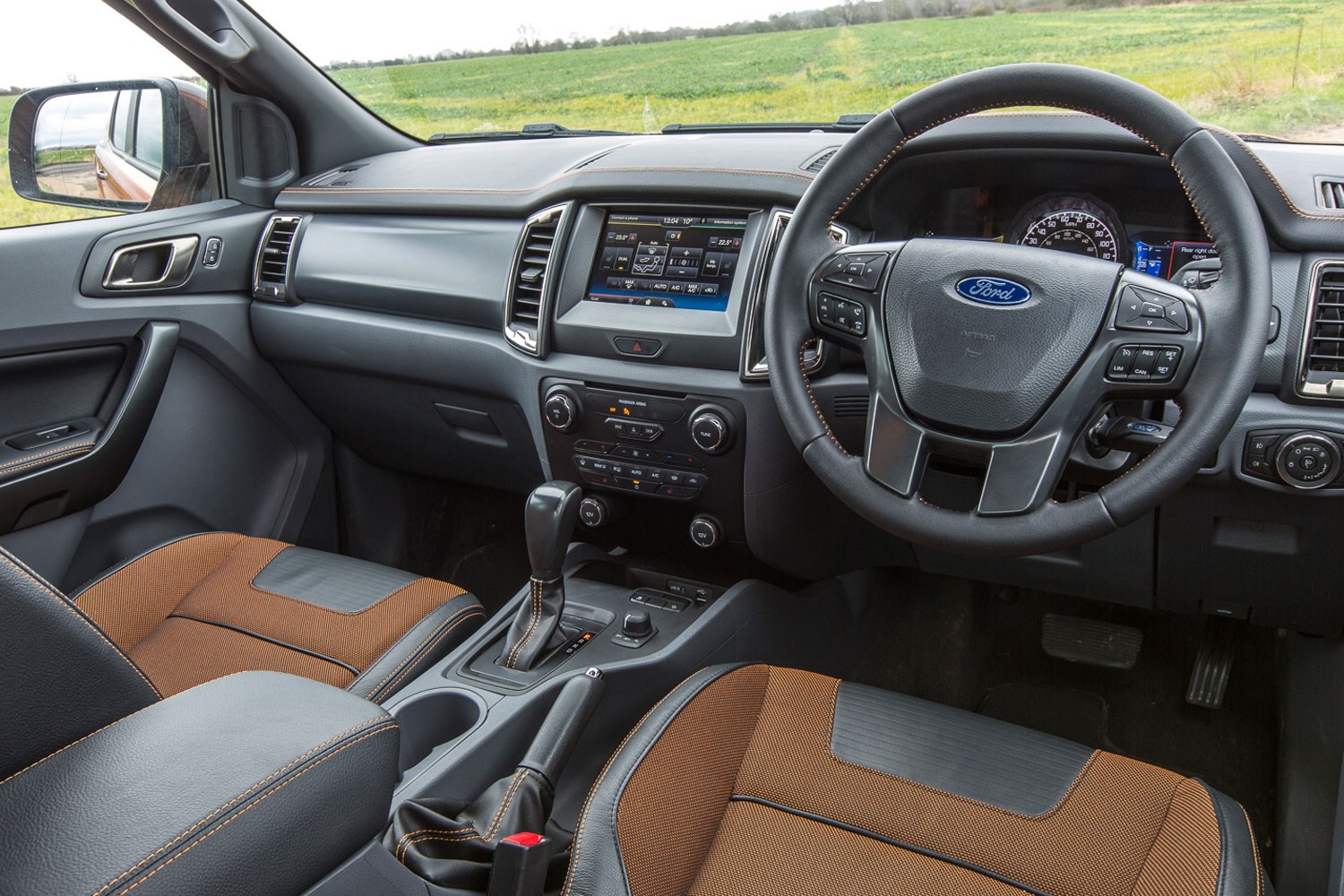 Ford Ranger review - 2016 facelift cab interior showing seats, steering wheel and dashboard