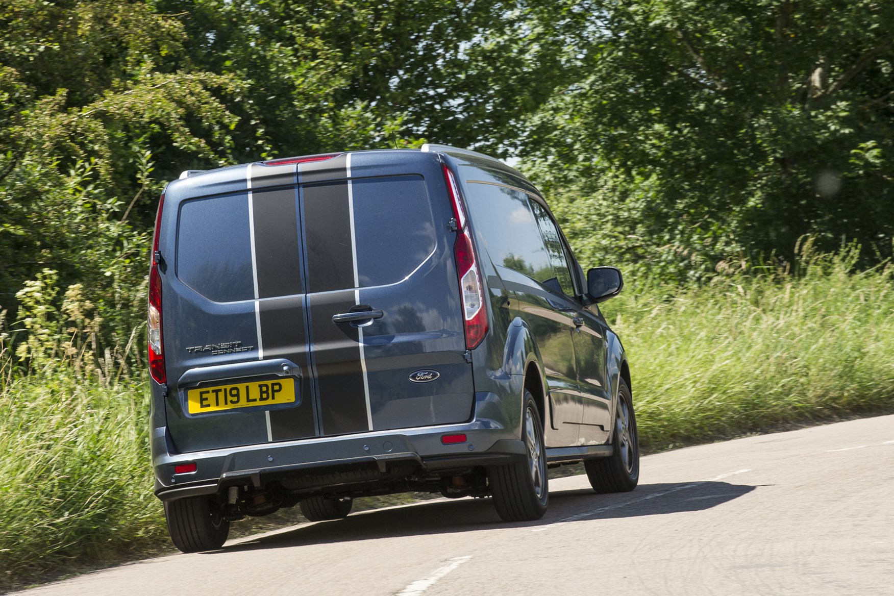 Ford Transit Connect review - 2018 Sport Van, rear view, driving round corner, Chrome Blue