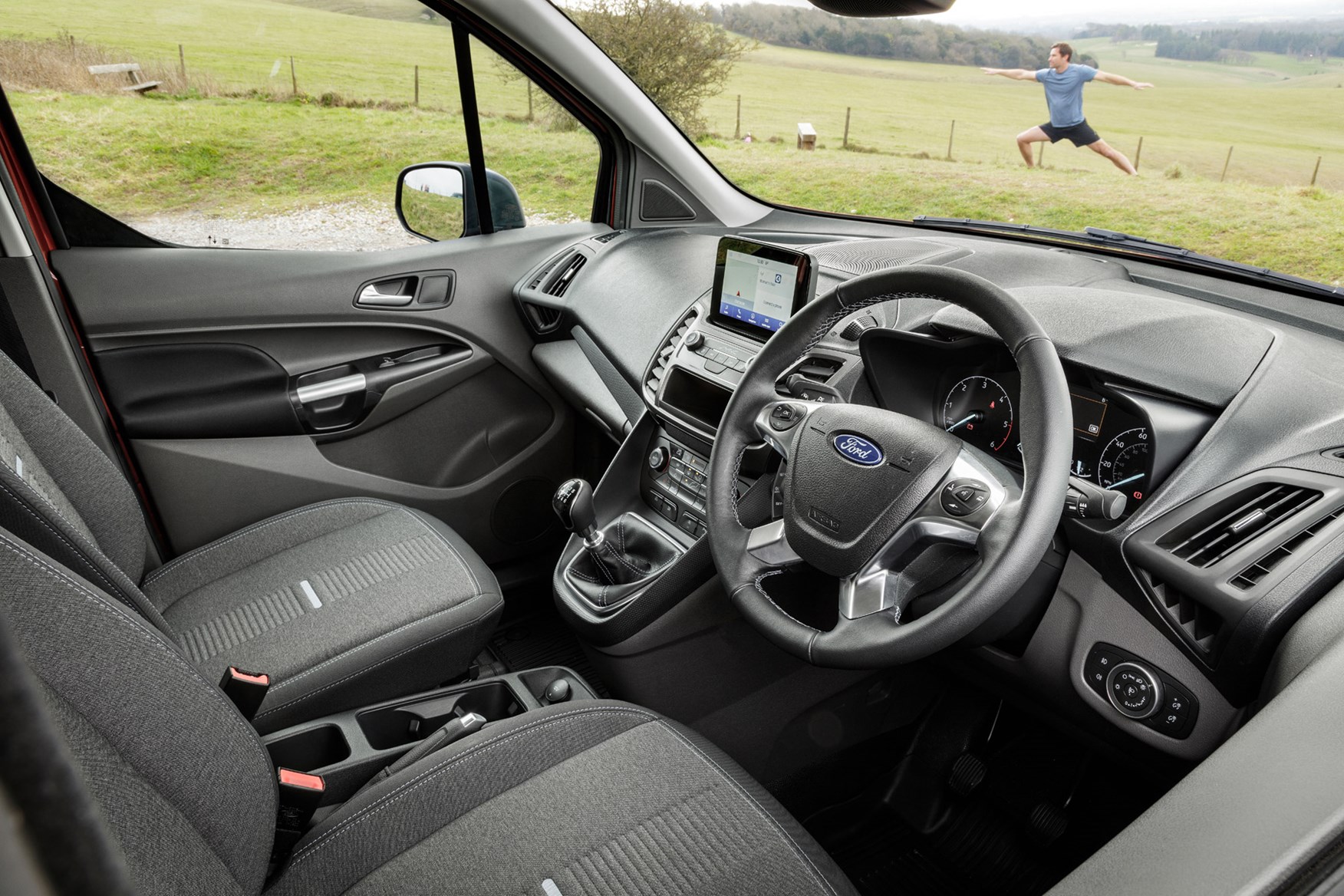 Ford Transit Connect Active review - cab interior with bloke doing yoga in the background